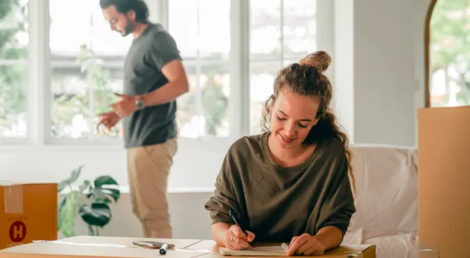 
Young spouses preparing to move into their new apartment