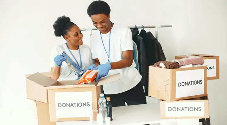 
Lovely Asian couple helping to put the clothes in donation 