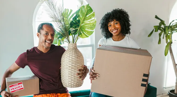 
Woman holding white cardboard box